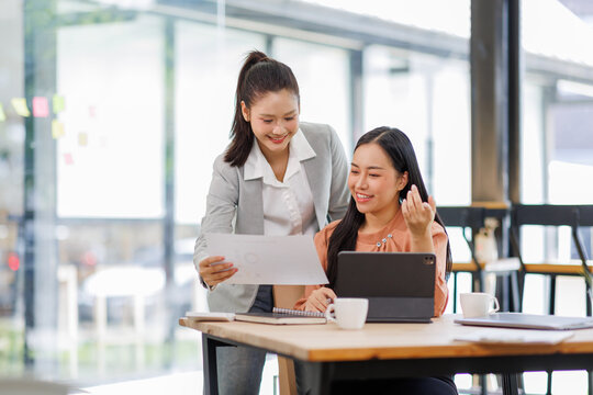 Business women and graphs on tablet screen for finance results, profit growth and budget review. Staff, team and digital with financial report, revenue stats and dividend comparison of risk assessment - Powered by Adobe