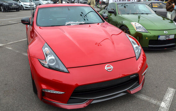 Dynamic red Nissan 370Z coupe, a powerful Japanese sports car performance oriented design and modern Z-car aesthetic