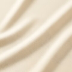 Fototapeta premium Soft cream colored fabric with smooth folds and gentle shadows