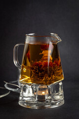 Hot tea in a cup on an old background.