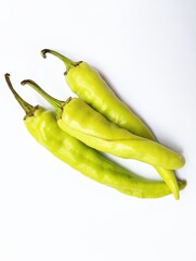 Green chili peppers in isolated white background 