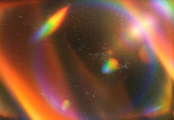 Abstract close up of colorful light refractions forming overlapping rainbow rings and lens flare patterns, creating a vibrant, dreamy texture for modern design work