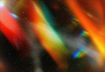 Fototapeta premium Abstract close-up of colorful light refractions and bokeh with vibrant rainbow hues, specks on a dark background, ideal for creative design, branding and digital art projects
