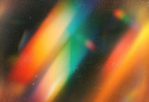 Abstract cosmic light streaks and vibrant color gradients swirl across a grainy dark background, evoking dynamic motion, energy, and artistic flair for modern design projects