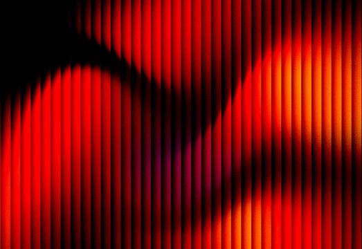 Abstract red and orange striped light pattern with vertical gradients and dynamic motion, a bold digital art background ideal for technology, marketing, and creative presentations