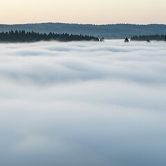 Soft focus background showing a thick layer of ethereal white mist slowly dissolving into the open air above a gentle landscape, ephemeral, design, soft focus