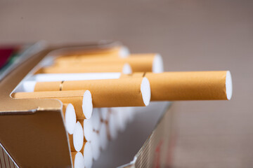 Close up of open pack of cigarettes on table