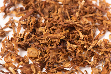 dried finely crushed tobacco leaves texture background.