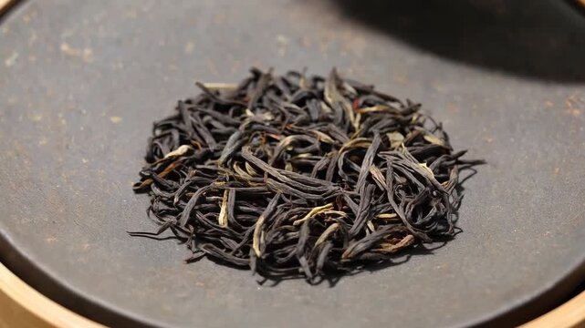 Close-up of loose tea on the plate Close-up of Jinjunmei tea