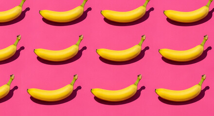 Fun and Colorful Pattern of Ripe Yellow Bananas Arranged in Rows on a Vibrant Pink Background Flat Lay Design