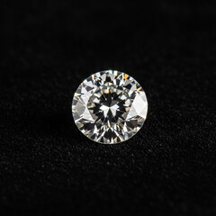 Brilliant Round Cut Sparkling Diamond Isolated on a Dark Textured Background Close Up Macro