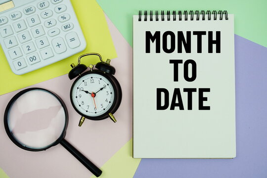 MTD Month To Date text with calculator, alarm clock and magnifying glass