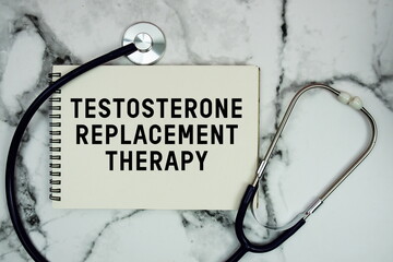 Testosterone Replacement Therapy text written on notepad with stethoscope and magnifying glass on marble background