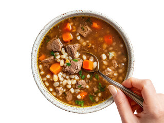 Beef barley soup with hearty ingredients held by woman&rsquo;s hand isolated on transparent background