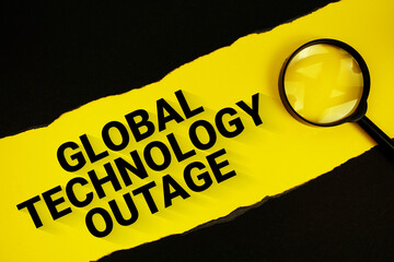 Global Technology Outage text on yellow with black paper torn ripped and magnifying glass