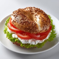 Sesame bagel sandwich with fresh green lettuce vibrant red tomato slices and white cottage cheese on a plate