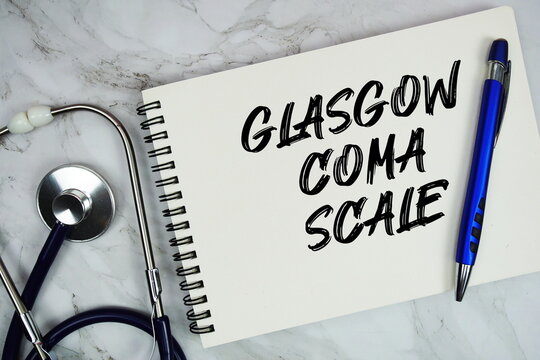 GCS Glasgow Coma Scale text written on notepad with stethoscope on marble background