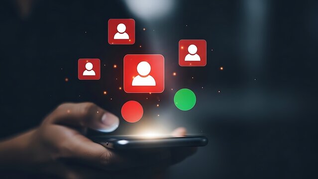 A hand holding a smartphone with glowing user profile icons floating above the screen - Powered by Adobe