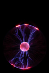 Plasma Ball with human hand causing plasma flow to jump to fingers creating unique patterns and textures
