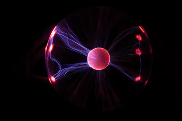 Plasma Ball with human hand causing plasma flow to jump to fingers creating unique patterns and textures