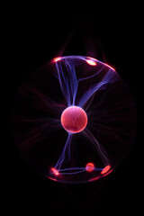 Plasma Ball with human hand causing plasma flow to jump to fingers creating unique patterns and textures