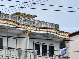 the house is located near the old building.