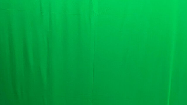 Side view of green screen background. Copy space, empty, free, negative, text, design. Isolated. Layout. Mockup. Close up. Backdrop.