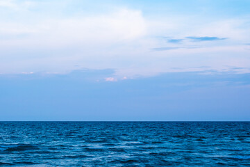 Obraz premium Nature clear sky and summer sea water for summer vacation concept.with sunlight of beautiful clouds blue sky with white altocumulus clouds.with 