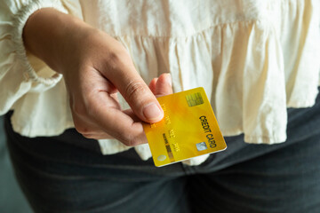 Woman holding credit cards and he is choosing a credit card to pay and spend Payment for goods via credit card. Finance and banking concept	
