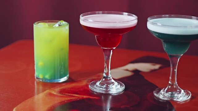 Close up pan shot of four different drinks representing global power centers