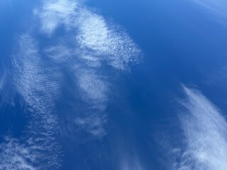 Blue sky and soft white clouds.