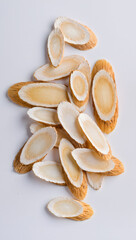 Sliced Licorice Root on White Background for Skincare and Herbal Ingredients
