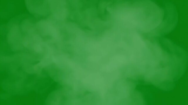 Wisps of ethereal green smoke swirl and drift against a vibrant emerald background.