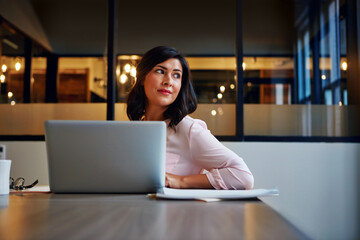 Thinking, business and woman with laptop in office for copywriting, planning and ideas for...