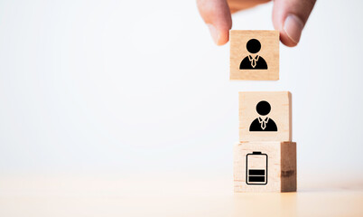 Manpower planning and management concept. Forecasting future staffing needs, analyzing current staffing levels and developing human resource strategies. Wooden blocks with manpower or staffs icons.