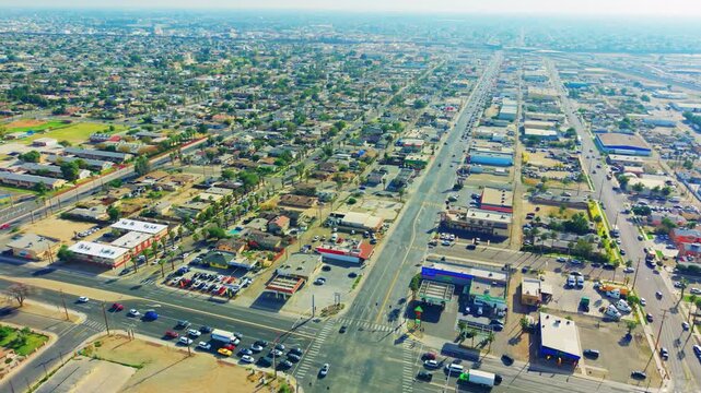 Drone footage of eastern Calexico highlighting residential neighborhoods, urban layout, and desert surroundings near the border.