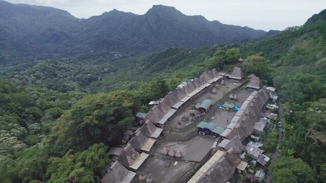 A high angle aerial shot of local people participating in a Reba Mass, blending Catholic liturgy with local traditions in Bena Village.
