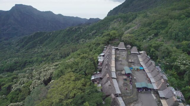 A high angle aerial shot of local people participating in a Reba Mass, blending Catholic liturgy with local traditions in Bena Village.
