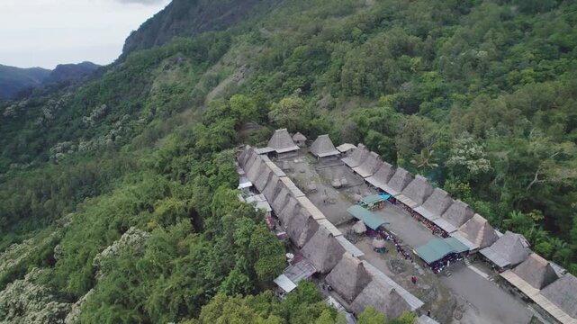 A high angle aerial shot of local people participating in a Reba Mass, blending Catholic liturgy with local traditions in Bena Village.
