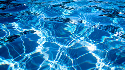 Sunlight reflecting on rippling blue water surface