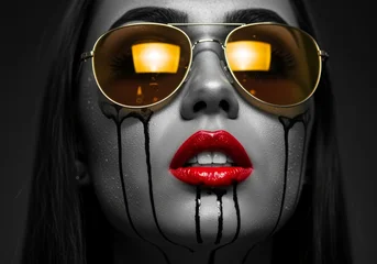 Close-up of Glamorous Woman with Vibrant Red Lips and Orange Reflective Shades © Hanskie28