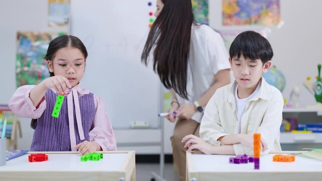 Elementary Students Learning Math with Colorful Building Blocks in Classroom
