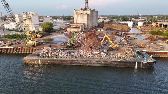 Metal Recycling Plant Loading Scrap Metal Onto a Barge in the Delaware River
