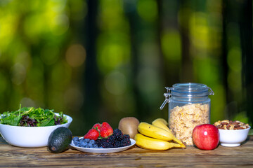 Fresh fruit with berries for breakfast. Morning food with natural oatmeal and berries. Nutritious gourmet with blackberry, raspberry, and banana. Healthy fiber-rich cereals combined with fresh fruit.