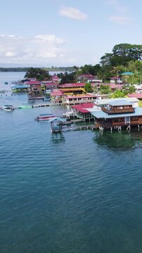 Vertical aerial push forward shot over Bastimentos Island in Panama&rsquo;s Bocas del Toro District, capturing coastal scenery and tropical landscapes.