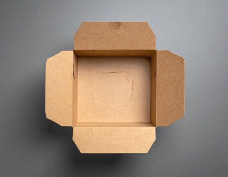 Open brown cardboard food box against a gray background