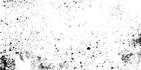 Obraz premium A grunge stark textured background featuring scattered black specks and smudges on a predominantly white surface
