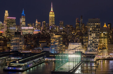 New York night skyline. NewYork City downtown at night. New York landscape. Manhattan night view. NYC metropolis aerial view. New York skyline. NYC cityscape. New York cityscape waterfront.