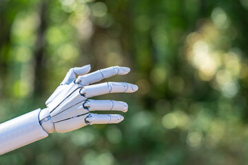 Robot hand. Robot touching concept on green nature background. Ai hand connection. Robotic hands concept.