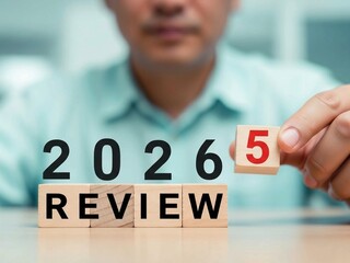 Business Review 2025 Turning Into 2026 on Wooden Blocks for Strategic Planning